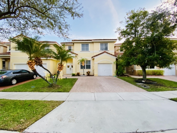 Front exterior and driveway of the home at 17024 SW 38th St in Miramar